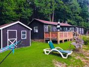 Experience Adirondack tranquility on 2.73 acres with 400 feet of serene Bouquet River frontage. This fully renovated cabin, completed in 2021, features charming knotty pine interiors and rustic Adirondack accents, creating the perfect cozy retreat. Currently a successful Airbnb with a strong rental history, it presents a great income opportunity or an ideal vacation getaway. With the potential to add a second bedroom, this property is also perfect for year-round living. Sale includes parcels #56.3-1-2.300 (2.37 acres) and #56.3-1-3.000 (0.36 acres). Donâ€™t miss out on this unique gem!