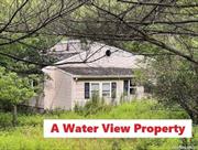 A Water View Property! About 2 Acre Lot (see the last picture), The main house has 3 bedrooms, and a mobile home addition can provide 2 more bedrooms. 4 bedrooms (and even the Bathroom) with a beautiful water view of Churchtown reservoir, Master Bedroom W/Den, Spacious Living Room, Formal Dinning Room, A Deformed Mobile Home in Backyard, Big Backyard and Side yard, 15 min from Hudson, 2 hours from NYC, Needs Full Renovation, Good for Handyman/Investors/End Users, Price to sell