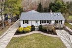 Step into coastal luxury with this beautifully renovated 4-bedroom, 2-bathroom home located in a quiet & secluded neighborhood in Hampton Bays. The kitchen and living room feature vaulted ceilings & new wide-plank hardwood floors creating a seamless flow throughout the main living areas. The spacious kitchen boasts a generous 10&rsquo; quartz island, perfect for meal preparation and entertaining. Enjoy the ambiance and warmth of the double-sided gas fireplace, visible from all rooms. Step outside to your private retreat, complete with an above-ground pool, expansive deck, large patio, and yard perfect for both relaxation and fun Summer gatherings. Additional features include a detached 2-car garage, 2 driveways, and updates such as a new roof, gutters, & CAC unit in 2023. Conveniently located near restaurants, beaches, Hampton Bays train station and shopping. There is a lot more to this home than meets the eye!