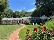 This renovated expanded ranch is perfectly situated on a flat, 1 acre, parklike property in North Greenlawn, Harborfields school district. The enlarged 4-car driveway was uniquely designed with specimen plantings and stone/boulder retaining wall. Enter this sunny bright house with its open-concept kitchen/den with cathedral ceilings, skylights, and wood burning fireplace that welcomes you home! The chef&rsquo;s kitchen with stainless steel appliances, Thermador propane gas stove, oven/microwave wall unit, stand-alone ice maker surrounded by granite countertops, and a bar-top island makes for easy living and entertainment. The private quarters consist of two large bedrooms, a full bathroom with jacuzzi tub, custom laundry room, and an expansive cathedral-ceilinged primary en-suite with oversized closet. This inviting en-suite with floor-to-ceiling tile, glass-enclosed steam shower, and granite bench provides luxury and privacy with pocket doors. The partially finished basement has egress windows, built-in cabinets, cedar closet, and a full bath for additional recreational space. Heading outdoors through the glass door sliders awaits you an impressive backyard oasis, perfect for entertaining on the patio or at the poolside in your professionally landscaped, perennial garden and lush green sprawling lawn. The In-ground saltwater pool has a new liner, filter and salt system with multi-colored pool lights for those warm summer nights. Just minutes away from library, schools, railroad, and quaint village of Greenlawn, and nestled between the vibrant town of Huntington and charming town of Northport. Take a short ride to the beaches of Centerport, Vanderbilt Museum, and hiking trails, round out this property as a prime location of what Long Island has to offer!