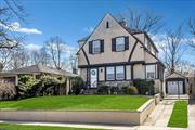 Beautiful Detached Brick/Field Stone Tudor Home located in the Douglaston Park Area offers a newly renovated (2023) Eat-In Kitchen with White Maple Cabinetry, Quartz Stone countertops, hardwood flooring, Stainless Steel Appliances, Coffee Bar area & Ceramic Tile Backsplash which lead to a private fenced in yard with covered patio area. Renovated 1 1/2 bathrooms, beautiful Hardwood floors throughout & basement with finished den/office with separate heating zone (Baseboard). New molding on 1st & 2nd Floor, Slate roof, (4) split systems - CAC/Heating, French doors to Formal Dining Room, new Recessed LED Lighting (2023), new Hot Water Tank (2020), Front/Rear Sprinkler System and 1 car detached garage with long driveway. Close to All...Must See!