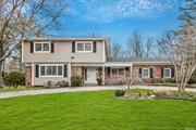 Welcome to this beautifully updated, sun-drenched five bedroom colonial on professionally landscaped grounds in the sought-after Lakeville Estates section of East Hills. This lovely home boasts a wonderful floor plan with a formal living room and formal dining room, a cozy den with fireplace, and a spacious, renovated eat-in kitchen with access to the beautiful flat backyard. The main level also features a bedroom, laundry room and powder room. The upstairs level includes four additional bedrooms, inclusive of the primary suite with sitting area. Highlights include wood flooring throughout, new roof, new central air condition system, siding, circular driveway leading to a front porch and two-car garage. Located within the East Hills Pool & Park District and Roslyn schools. A must see!