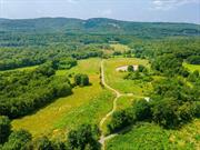 Accepted offer, contracts being prepared. Seize the Hudson Valley&rsquo;s Prime Investment Opportunity Elevate your investment portfolio with a unique property that embodies the essence of the Hudson Valley. Situated within the coveted town of New Paltz , this expansive 75-acre parcel presents a captivating blend of natural beauty, history, and unlimited agricultural potential. Once a thriving equestrian facility, this property&rsquo;s landscape still echoes the legacy of its past. This former equestrian facility, with its scenic backdrop of the Shawangunk Mountain range, offers an array of assets with lush pastures and two former stables, other out buildings, a 4 bed 2 bath home: the foundation for a revitalized venture is already in place. This property transcends the conventional, offering investors the chance to tap into the burgeoning agritourism scene. The existing distillery, which crafts spirits from organic farm-grown heirloom grains on the property, lends a unique touch to the property&rsquo;s offerings. Embrace the privilege of becoming the steward of this remarkable property. Investors are invited to explore various avenues of growth, from unforgettable weddings, agritourism experiences and fundraising events against the backdrop of the Shawangunk Mountains to the growth of an established destination distillery experience. The business along with the inventory and equipment can be purchased as a package deal at an additional cost.