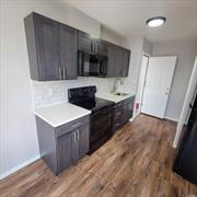 This is a newly renovated, cozy 2-bedroom apartment on the 2nd floor of a mixed-use building with a private parking lot in rear. Unit includes: brand new cabinetry, quartz counter tops, luxury vinyl flooring throughout and newer appliances! This unit is centrally located between Huntington Village and West Jericho Turnpike, about 2 miles each way. This location is ideal for public transportation use: 0.6 miles from the LIRR and the nearest bus stop is 0.3 miles from the unit.