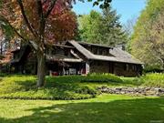 SEASONAL RENTAL. Straight out of a storybook is this enchanted log cabin secluded in the forest overlooking the Webatuck Creek. The primary bedroom with its own fireplace overlooks the waterfall and gardens. There are two additional bedrooms, one with a queen bed overlooking the creek and the other reached by its own staircase has twin beds. There are two baths, one with an adjoining a room just for a soaking tub. This period home, built in 1933, affords a rustic allure with classic furnishings and original hardware yet many conveniences of the modern world. So many charming spaces to enjoy, from the elegant great room with soaring ceilings and stone fireplace, to the delightful porch where one would want to curl up for a nap to the sounds of cascading water. This magical setting of 8.2 acres, is located directly on the creek overlooking a waterfall. Enjoy fly fishing or a cool dip in the summer. The property exudes peace and tranquility while located just five minutes from the Metro North train and convenient to Kent and Sharon, CT as well as Millbrook. Nearby amenities include Harlem Valley Rail Trail, Silo Ridge Field Club, Millbrook Hunt Club, Mashomack Club, the drive-in movie theater, Lakeville Lake, Troutbeck, and all of the area&rsquo;s incredible outdoor recreation, restaurants and shops. No pets. References & credit check required.