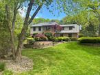 Welcome home to this Beautiful Colonial in the Prestigious Nissequogue Overlook Neighborhood! Step inside to a Grand Entry Foyer that leads to a Beautiful Chefs Kitchen with Custom-built Cabinetry, top of the line appliances, A Center Island & Breakfast Nook. On the main floor you will also find an Oversized Formal Dining Room, Formal Living Room, Family Room w/ Stone fireplace & Built in cabinetry(Lots of Natural Lighting), laundry room & powder room. Head upstairs to the Primary Ensuite & primary bath w/ radiant flooring! Down the hall you will find an additional full bath w/ radiant heat and 3 additional Spacious Bedrooms. The finished basement features a Large Rec Room W Built in shelving, ample storage space & workshop/utility area. Step outside to your own Country Club yard with a Heated Saltwater Mountain Lake Gunite Pool w/ waterfall(newly tiled & marble dusted) & an outdoor wet Bar with ample seating for entertaining! All of this and so much more situated on over 1-acre of Lush property (Very Private)! Additional Features include .... Hardwood Floors throughout, custom moldings, Camera security System, 2 Car side entry Garage, brand New 80-Gallon water heater, CAC-2 Zones, Oil-Heat 3-zones, Roof-30 Yr Architectural(2011), Vinyl-siding, Andersen Windows & All New Paver Patio, Walkways & Blue Stone Steps! An absolutely gorgeous home that will not last!