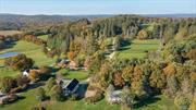 Welcome to a once-in-a-lifetime opportunity to own an exceptional equestrian estate sprawling over 206 unrestricted acres in the heart of Millbrook hunt country. Originally built in 1865, this property has been meticulously expanded with a lavish addition spanning over 6000 sq ft, seamlessly blending antique charm with modern opulence. Enjoy miles of fenced pastures, riding trails, ponds, and panoramic views of the Catskill Mountains just minutes from the Village of Millbrook. Formerly owned by Margaret Carnegie, only child of Andrew Carnegie, this estate offers a piece of history and unmatched luxury. The main residence features a paneled library with fireplace, formal dining room with fireplace and a very generous living room with yet another fireplace and very high ceilings. Two staircases leading to separate wings and an elevator service both the primary suite and the finished basement. Designed by French architect, Atelier Choiseul, the exceptional stable boasts stables, paddocks, a feed room, tack room, lounge, and staff apartments. A hunter trial course adds to the recreational opportunities. Just minutes from Metro-North station, and a 90-minute commute to Manhattan, indulge in country living with access to prestigious activities like the Millbrook Hunt and Mashomack Polo. This rare offering provides unparalleled privacy, nestled in the serene countryside, yet with convenient access to urban amenities. Embrace luxury in the Hudson Valley&rsquo;s most coveted location.
