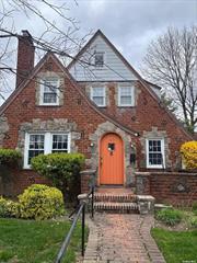 Welcome to this beautiful classic Tudor home. Upon entering you find yourself in a jewel box of a foyer lined with book shelves. Then you step into a comfy living room complete with inlaid hw floors, and leaded glass windows flanking a stately fieldstone fireplace. Next is a large FDR leading to a spacious EIK with a breakfast nook, and granite countertops. First floor also has a generous BR and Fbr. Up the stairs on the upper level you will find a sweet bedroom with a wic and a very large main BR The basement boasts a wet bar and fieldstone fireplace. All bedrooms and entry have cedar closets. At the beginning and end of the day enjoy the beautiful screened porch overlooking a lovely backyard.