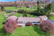 CALLICOON NEW YORK COUNTRY ESCAPE!! Beautifully maintained ECO-FRIENDLY 4-bedroom ranch with an amazing view of the mountains and farm across the quiet country road. Renovated top to bottom with top-of-the-line appliances, KraftMaid kitchen cabinets, Granite countertops, High-efficiency Split units, and new flooring throughout. The primary Suite is fully separate from the rest of the house making it ideal for Short Term Rentals. The 3-car detached garage has an Electric EV plug for Car charging, remote door openers, and paved driveway access. Minutes to the charming village of CALLICOON, the wild and scenic DELAWARE RIVER, historic music venue BETHEL WOODS Performing Arts Center, RESORTS WORLD CASINO.  10 Raised bed gardens, Fruit Trees, and Fenced area for Pets and youngsters. WHOLE HOUSE GENERATOR (GENERAC 4500KW output. And lastly 21 Ground Mounted SOLAR Panels: the ideal COUNTRY GETAWAY plus potential income-producing short-term rental.