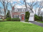 Welcome to 18 Polly Lane in the coveted Harbor View neighborhood of Glen Head. Featuring three bedrooms and one and a half baths, this classic, brick colonial is the epitome of gracious living. Perfectly situated, sunlight pours in throughout the home. Cozy up to the wood burning fireplace in the formal living room boasting oak floors and a picture window. Entertain in the dining room which includes built-in cabinetry and oak floors, which flows to a pine paneled den with walls of windows. The kitchen, which has convenient access to the attached garage, boasts delightful views overlooking the verdant yard consisting of mature plantings, an in ground sprinkler system, and a beautiful circular patio great for entertaining. The upstairs level features three bedrooms, all accented with charming details and original brass hardware, as well as a full bathroom. The basement with laundry offers endless possibilities. Conveniently located near schools, shops, and the railroad, don&rsquo;t miss this opportunity!