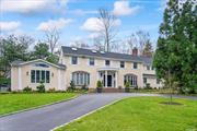 Prepared to be impressed upon entering this -4000sqft Colonial located in the prestigious Village of Laurel Hollow/Cold Spring Harbor School District. Greeted by foyer leading to living room with adjoining dining room and family room featuring vaulted ceilings and hardwood floors, creating one expansive entertaining space. Eat-in kitchen with custom cabinetry, two dishwashers, Wolf double wall oven, wine fridge, built-in breakfast nook, radiant floor heat and glass sliders to rear patio. Library with built-ins, desk, and fireplace. Guest bedroom, full bathroom, laundry and access to 3 car garage with custom built-in storage complete the first level. Second level encompasses 4 bedrooms include 1 en-suite and primary en-suite bedroom wing with office, walk-in closets, and luxurious bathroom with radiant floor heat. Basement provides storage and potential recreation space. Situated on 2 acres surrounded by mature trees for privacy, flower gardens, circular driveway, and large rear patio with built-in Viking grill. Convenient to Cold Spring Harbor/Huntington Villages with parks, restaurants, shopping, library, and hiking trails. Nearby Caumsett State Park and Laurel Hollow Village beach (dues) with mooring rights and kayak storage. Just 4.5 miles to L.I.E./Northern State Pkwy, 30 miles to the Midtown tunnel, and 2.5 miles to train station with direct lines to Grand Central and Penn Stations. Generac generator