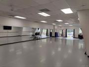 4500 foot space former dance studio , fitness space ample parking a bright well lit space has 3 other rooms central air and its clear span . Also has a kitchen located in village proper walk to post office and restaurants private entrance . Great space 10 foot ceilings great for many uses destributiin , wharehouse or data canter ground floor and over head doors could be installed .