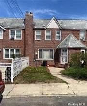 Brick attached townhouse with party driveway and detached garage.. Convenient to all