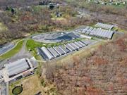 First time available in decades. This well-constructed, fully operational agri-business facility used as an herb and flower growing operation until recently. All the mechnical devices, heated soil lines, lighting, temperature controls, heat in place to start planting now for the fall season. Room to expand, grow on the outside as well with over 20 acres undeveloped and cleared.  Overlooks the Wallkill River, easy access, all fenced in,  internal roadways in place and over 17 greenhouses (some doubles and triples) operational.  Some office space for staff and billing, plenty of employee parking and a huge opportunity for someone who understands the growing business, or wants to augment their current operations.