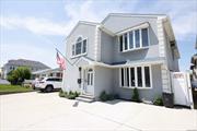 Welcome to your dream coastal retreat at in Long Beach, NY! perfect for M/D or large families This charming 6-bed, 4-bath duplex home boasts 2880 sq ft of luxurious living space. Recently renovated to perfection, this gem is just block&rsquo;s away from the sandy shores and tantalizing restaurants, offering the ultimate beachside lifestyle. Step inside to discover stunning Victorian decor, accentuated by various accent walls and sparkling crystal chandeliers, creating an ambiance of timeless elegance. With ample room for parking, including space for 3 cars, convenience meets luxury seamlessly. Whether you&rsquo;re hosting gatherings or enjoying quiet evenings, the spacious layout offers versatility and comfort. And with all paint codes available, personalizing your sanctuary is a breeze. Only 2 blocks to LIRR close to parkways and public transportation walk to boardwalk , beach , restaurant&rsquo;s shops and parks