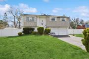 Bay Shore. Lovely 4 Bedroom, 1.5 Bath Hi- Ranch. Eat-in Kitchen, Living Room/Dining Room, Attached Garage. Must See!