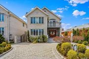 Welcome to this custom-built brick colonial in the heart of Whitestone. Beautifully renovated in 2003, this home is adorned with high end imported finishes and materials. As you step inside, you&rsquo;re greeted by a grand entry foyer with a cathedral ceiling and adorned with porcelain flooring. A home embellished with detailed venetian plaster crown moldings exudes timeless elegance and architectural sophistication. The spacious living room with its picture window allows ample natural light to flood the room. It flows seamlessly to the formal dining room that offers great space for gatherings. A fully equipped custom eat-in kitchen featuring, granite countertops, an abundance of custom cherry wood cabinets and premium appliances combines aesthetic charm with practicality. The great room is situated off the kitchen and features a cozy wood-burning fireplace, perfect for chilly evenings. The glass door linking the kitchen to the outdoor patio and yard seamlessly blends indoor to outdoor living. The elegant staircase design combines the durability of imported marble with classic appeal of custom iron railing providing elegance, functionality and visual charm. The entire first level is heated by radiant heat. The second -floor landing provides access to a front balcony, offering a charming outdoor retreat from the upper level of the house. Upstairs, you&rsquo;ll find three large bedrooms and two baths all featuring hardwood floors . The primary bedroom is highlighted by a large walk in closet and a full bath boasting a luxurious soaking tub and a bidet, adding a touch of relaxation and comfort to the space. Downstairs,  a large walk-out basement awaits, complete with an open layout , providing a versatile space that seamlessly connects to the outdoors. The outdoor space is perfect for entertaining and is equipped with a built -in BBQ and pizza oven imported from Italy providing a convenient cooking area. Just seconds from Francis Lewis Park, this location is perfect for those who love to enjoy the outdoors and accessing all highways and two bridges.