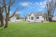 New Kitchen with Quartz Countertops, 2 Renovated Full Bathrooms, New Siding, New Boiler, New Floors, Full Basement with Outside Entrance.