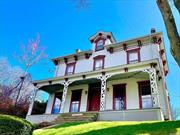 Welcome to one of the select few Jewels of Oyster Bay. This rare Italianate Victorian house, circa 1860, stands proudly at the gateway to the historic district. Designated as a landmark by the Town, it has also been recognized by the Historical Society for Preservation for its significant details including ornate exterior brackets, decorative porch accoutrements and interior panelling. Zoned Residential/Office, this unique structure gives one the opportunity to fulfill their dream of repurposing the house into a single family home or a professional office. Architectural highlights include rocking chair porch, elongated windows, interior crown moldings and baseboard moldings and 9 foot ceilings. Walk to town, enjoy many renowned restaurants, quaint shops, T.R. Park and beach and LIRR.