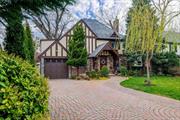 Welcome to this quaint, storybook home nestled on a quiet court in the much desired Strathmore neighborhood. Step into this sunny Tudor and feel the charm with your first step into the welcoming foyer. The first floor, fully renovated in 2016 has beautiful wide planked hardwood flooring throughout the entire first floor. Step into the large living room with Field Stone flanked gas fireplace. French doors lead you into the Den, large enough for the entire family to gather. The beautiful chefs kitchen with custom cabinets, granite counters, ss appliances, dry bar w/refrigerator and a cozy breakfast nook for daily family meals. The formal dining room w/paneled walls is the perfect room to gather for large family holidays. Head to the second floor to the primary ensuite with 2017 renovated full bathroom, over sized walk in custom closet plus 2 additional custom closets. Down the hall is a large bedroom with a deep closet with double hanging bars for plenty of storage. Down the hall is a tandem bedroom that can be counted as 1 or 2 rooms, each room with deep closets. 3rd floor pull down ladder has plenty of storage for holiday decorations, off season clothing etc. Finished basement with Laundry Room. This home is not to be missed!!!