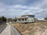 PRICED TO SELL... Nestled on the serene and highly coveted Ocean Beach of Fire Island, New York, 85 Bungalow Walk presents a rare opportunity to own an oceanfront gem. This exceptional property boasts breathtaking ocean views from nearly every room, offering a unique chance to immerse oneself in the tranquil beauty of the seaside from the comfort of home. With three bedrooms, two bathrooms, and two expansive decks, this residence combines comfort with the luxury of oceanfront living. The rarity of such a find in Ocean Beach, known for its limited availability of oceanfront properties, makes this offering a once-in-a-lifetime opportunity to secure your own slice of paradise.