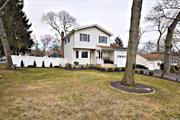 This beautiful colonial is in the Village of Lake Grove. An impeccable home that has hardwood floors in the formal living area, kitchen has granite countertops and the dining area is open to the kitchen for easy access. Family room/den area has a cozy fireplace and vinyl flooring that opens to a large back porch. There is a finished basement for more hangout space and a laundry room. New exterior capping and soffits. This house shows beautifully with a neat manicured front and back yard. A warm and inviting home. This house will not last long!