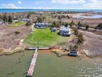 A dream come true for all boaters, beach-lovers and salt-life enthusiasts - this property offers nearly 2 acres waterfront, privately situated on the beautiful and serene Harts Cove in coveted East Moriches, with bulkhead/docking, breathtaking views and unbridled water access. The main house features 5 total bedrooms, 2 full bathrooms, a formal dining room, 2 spacious living areas with vaulted ceilings and large windows facing the bay. Plus, 2 large detached cottages, both with private decks overlooking the bay. The larger cottage also includes a basement/workshop with lots of storage,  separate laundry area and outdoor shower. This home has been lovingly owned by one family for close to 60 years and has excellent bones with truly unlimited potential. Only 15 mins from Westhampton Beach, 5 mins from Eastport Hamlet, and 5 mins from downtown Center Moriches. Here is the opportunity you&rsquo;ve been waiting for!