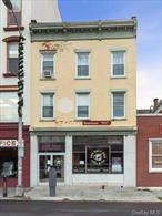 Mixed use brick building located adjacent to the Bardavon in the heart of the City of Poughkeepsie. The building consists of 2 apartments on the third floor, 2 second floor office suites, and a large retail space. The building also offers a large basement with a finished lounge area with fireplace and additional bathroom. The retail space is vacant and available for owner-users. Building is located within the Opportunity Zone. Both apartments have been recently renovated.