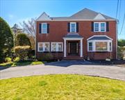 Welcome to your tranquil retreat in the heart of Rockville Centre. Hidden behind the hedges find this charming red brick colonial home effortlessly blending classic elegance with modern comfort. Situated on a private 1/3-acre lot and facing east, it welcomes the energizing sunrise each morning. Outside, privacy promotes harmony with nature, creating a serene backdrop for relaxation and al fresco dining. With easy access to Mill River Park and the Long Island Railroad, convenience meets tranquility in this Rockville Centre gem. Inside discover a cozy den with a fireplace, spacious office, formal dining room and formal living room and a gourmet kitchen await, while a conservatory adds a serene space filled with natural light, perfect for indoor gardening or yoga. Additionally, a mudroom offers convenience for everyday living, while a back staircase provides easy access to the upper floors. The second floor provides four bedrooms and four full baths, providing ample space for relaxation and rejuvenation. Three out of the four bedrooms boast en-suite bathrooms, ensuring privacy and comfort for all occupants. Unlock harmonious living in this exquisite colonial masterpiece today!