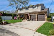 Hurry... This Four-Bedroom 2.5 Bath Colonial In The Heart of Wantagh Woods Is Nestled On A Picturesque Cul-De-Sac. This Meticulously Maintained And Newly Renovated Home Offers An Open Concept. The First Floor Features A Luxury Designer Kitchen And Radiant Heat Throughout The Tiled First Floor. Characteristics Are A Formal Living Room, Dining Room With Hutch Featuring Glass Doors To Display Your Treasures And Finery And Lower Cabinets. Entertain Or Relax In The Oversized Den With A Stone Gas Fireplace That Has An Auxiliary Blower (enhances heat to another room) Presently Funneling Heat To Master Bedroom. Other Features Include But Not Limited To The Following: Hardwood Floors, 3-Zone Heating, Newly Updated Central Air Conditioner And Handler, 6-Zone In-Ground Sprinkler System. Relax, Enjoy and Delight In The Resort-Style Fenced-In Private Backyard And In-Ground Heated Pool With New Liner, Loop-Lock Cover, Heat Pump And Polaris Auto Vacuum. Adding To Your Enjoyment Is An Out -Door Kitchen, Turf Grass And Pavers. This Dream Home In Wantagh SD 23 Is Rare. Please Note The Total Taxes Are Quoted Without The Star Exemption Which Is Presently $1297.00. Make This Your Forever Home!