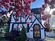 Updated three bedrooms Tudor with Arched cased openings, stained glass window and tons of wood moldings. The entry foyer leads into the large living rooms with fireplace and lots of windows for beautiful light throughout the day. Large formal dining room, updated kitchen with wood cabinetry, tile floor. There is a half bath and great storage in the pantry closets. The 2nd floor primary bedroom with lots of closets and arched case opening to the front sitting area with triple windows. Two additional bedrooms and updated full bath with jetted tub and separate shower. The third floor is full, finished attic with more storage closets! The basement if finished with, rec room, washer and dryer, work room, utilities and storage closets. There is a brick patio, fencing, gardens and an over sized 1-car garage. This home is located in the Village of Mineola and the Mineola School District and close to everything central Nassau has to offer! Great shopping, major parkways, LIRR (with a 40 minute commute to NYC), fabulous Eisenhower Park and the South Shore Beaches are a half hour away!