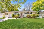 Charming Ranch Home with Wood Floors on the East Side of Deer Park. Features 3 Bedrooms, 1 and a Half Baths. The Primary Bedroom includes an en-suite Half Bath. A versatile Den/Family/Office space provides access to the Garage. Enjoy updated Stainless Steel appliances. A Slider from the Dining Room opens to a spacious Patio. The Driveway and paths leading to the front door, along the south side of the home, and to the backyard patio are all crafted in Pavers and have been freshly pressure washed. The expansive Finished Basement with closets, an open recreation room, a laundry rm and a storage rm, has been renovated with Pergo flooring. Includes a Certificate of Occupancy and an Egress Window. A beautiful property ready for move-in!