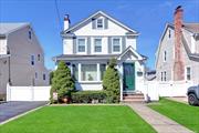 Welcome to 15 N. Cambridge Street, Malverne NY 11565. As you approach this home on the very quiet dead end street you will see a very well maintained and picture perfect Colonial. As you enter this home you will see a ceramic tiled entry foyer. As you continue you will see the staircase to the second floor and the large living room to your left with a skylight and wood burning fireplace with hardwood floors under the carpeting. The ceramic tiled hall continues into the eat-in-kitchen past the coat closet and the pantry as well as the modern half bath in the hall. The ceramic tiled eat-in-kitchen features wood cabinets and stainless steel appliances. There is a table with four chairs in the kitchen. The oversized windows make this kitchen very bright. Off of the living room and eat-in-kitchen is the banquet sized formal dining room also with wood floors under the carpeting with a large wall a/c unit and a door to the deck. The second floor features three bedrooms all with closets and a full bath with a separate stall shower and a jetted soaking tub. The full basement features a side door entrance and an egress window. There is a laundry room, a utility room, a modern full bath and a recreation room with closets. The door from the dining room leads out the deck, the yard and the garage. The yard is fully fenced in with PVC fencing. This home has in-ground sprinklers, a Slomins security system and is all gas heating and cooking. There is off street parking for five to six cars on the long driveway and garage. This home is located is within walking distance to all of the shoppes in the Village as well as the LIRR station and schools. The roof on the house (excluding the garage) is a Timberline roof that was installed in 2005, the gas boiler & hot water heater were also installed in 2005 and there are hardwood floors under all of the carpeting on the first and second floors. This home was built in 1928 and sits on an irregular 40X97 with 3, 920 square feet of property. The house has 1, 470 square feet of living space on the first and second floors. This is a beautiful home!