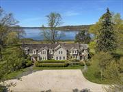 Capturing panoramic seascapes from almost every room, this recently renovated home is sited on 4+ pastoral acres of waterfront overlooking Oyster Bay Harbor, Centre Island and Cove Neck. Known for generations as Youngs&rsquo;s Homestead, this shingled farmhouse dates to the earliest settlement of the area and was a long-time center of colonial life. Framed by cherry trees, a gated entry welcomes guests down the long driveway through an alle of trees. Pristine boxwoods and stone walls flank the home while lush lawns roll gently down to the waterside. The home&rsquo;s site at the end of Oyster Bay Cove offers wide vistas of the blue harbor that leads out to the Long Island Sound. Covered porches and an exquisite dining Pergola with a profusion of climbing hydrangeas are perfect for outdoor entertaining. A separate boat house is used for storing sailing gear and acts as a recreation space.  A charming Dutch door opens to the new entry hall, walls now stylishly clad in reclaimed oak paneling, with the first view of the water at the end of the hall. The Library is warm and welcoming with a woodburning fireplace, window seat and exposed beams. Built-in bookshelves and media closet are new amenities as well as the handmade windows, made to match the original Living Room windows. At the end of the hall, a new addition, primely positioned, has an elegantly paneled Wet Bar with two refrigerators, drawers for cans, icemaker and wine fridge for ease of entertaining in the principal rooms or outdoors. The well-proportioned Living Room expands from the front of the house to the rear, with a bay window for impeccable water views. Fine woodworking, found throughout the home, is exceptional in this room with built-ins, exposed beams, new wood burning fireplace and floors of old growth European Oak. Casein milk paint creates a subtle texture on the walls. The formal Dining Room was a 1930s addition that offers an inviting room with fireplace for large or intimate gatherings. Open and airy, with wide plank floors and a china closet for storage. The Dining Room opens to the Sun Room, a delightful room for three seasons with all new windows that open to let fresh sea breezes in and ignite the senses. The thoughtful renovation has now created a Kitchen which functions perfectly for modern living with a large area for cooking and prepping featuring stainless steel appliances, 2 sinks, granite counters and an antique wood table that serves as the center island with Gaggenau gas stove. New improvements include glass front cabinetry, pantries and exposed beams. A brick fireplace and custom built hutch add to the appeal of the Breakfast Nook. The floors are engineered old growth European Oak for easy maintenance. The last wing of the home holds the Family Room with brick Fireplace, half-timbered wood beams and French doors and floor-to-ceiling windows capturing water views and opening to the deck. There is also a full Bathroom. This wing offers a back stairwell, window seat, side entrance and outfitted Laundry Room with sink and shelving. Additionally, there is a Guest Powder Room on this floor, tastefully decorated with English, hand-painted Fromental wallpaper.  The Primary Suite, on the second floor is a tranquil haven with calming water views. French doors open to a balcony redone with Brazilian hardwood flooring and mahogany railings. The Primary Bath, also facing the harbor, has radiant heated marble floors, a large shower and bathtub. There are five additional Bedrooms on this level. Each is unique with charming decor. The largest Bedroom has its own balcony. Two Bedrooms have ensuite Bathrooms. At the end of the hall, is a spacious Gym with high ceilings. The Home Office with cathedral ceiling. Behind the exquisite decor, much work was done to ensure that future generations will enjoy Young&rsquo;s Homestead including leveling floors, new windows, new French doors and insulation. Utilities and storage are found in the lower level, including new geothermal HVAC system.