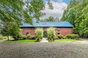 CONVERTED BARNS WITH POOL. This charming getaway offers fun lofty spaces to gather, entertain and enjoy the countryside, while conveniently located to the TSP and Millbrook Village. This 19th century converted barn was beautifully preserved and showcases the exposed beams and wide board floors. Upon entering, one is enamored by the soaring vaulted ceilings with exposed beams in the center of the home. A wall of glass in the living room seamlessly bridges the interior to the bluestone terrace outside. The bright country kitchen with whitewashed beams is complete with a fireplace. Offering 2, 820 square feet this home includes a music room and three bedrooms each with their own updated ensuite bath. Adding to the charm of this property is another converted barn used as a pool/guest house. Enjoy the summer by the heated saline pool in this peaceful setting.