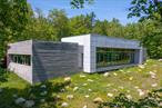 A House in the Woods. Welcome to the architectural brilliance & contemporary luxury. This 4-BR, 4.5-BA, 4, 071-sf home abuts the Awosting Reserve & is sited on 8.49 acres, with no neighbors in sight. Step inside & be greeted by natural light streaming through 15-ft floor-to-ceiling windows. Designed to exacting specifications & LEED silver-certified, there are 74 roof-mounted solar panels, radiant-heat flooring, an open-concept kitchen, custom cabinetry & top-grade appliances. A mere 2 hrs. from NYC, 30 mins. to New Paltz & 40 minutes to the Poughkeepsie Metro-North/Amtrak station. Additional Information: Amenities:Guest Quarters, Marble Bath, Soaking Tub, Stall Shower, Storage, ParkingFeatures:1 Car Attached,