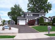 Welcome to 63 College Rd, A Gorgeous Clean and Bright Home Updated Throughout,  Walking up your Paver Walkway to Paver Stoop. Feel the warmth as you enter this home. View of all Rooms, Crown Moldings Matching Staircase,  New Open Floor Plan Eat in Kitchen with many cabinets, Pantry,  Sit at your wrap-around Granite Counters, Stainless Steel appliances include a Wine Refrigerator, Overlooking Dinette area or Dining Room. Large Living Room,  ? Bath, Large Dining room or Den with sliders to Large Paver Patio, Professionally Landscaped Totally Fenced Beautiful Yard,  Master Bedroom Is Huge Front to Back of Home with Jack & Jill Full Bath, Two more nice size Bedrooms. Home come with updated floorings,  Raised Panel Doors, Partial, Basement with New 2 Zone Heating System and Crawl Space for Storage. Newer Anderson Windows, Newer Roof, 200 Amp Electric, New Belgium Block Driveway and much more.