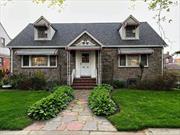 Large Roomy Sunny Laurelton Home with a gigantic fenced-in backyard. This home has built-in sprinklers to help with watering the lawn and Andersen Windows (so you never have to buy windows again)! The inside boasts beautiful hardwood floors and large rooms. Don&rsquo;t miss this opportunity.