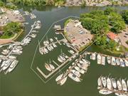 This highly unique offering&rsquo;s highest and best use is envisioned as a mixed-use waterfront development. It is one of the last properties of its type on Long Island Sound, where, by special permit, one can imagine a residential development with owners having their own boat slip right out their front door! The property expansion into the channel ensures uninterrupted water views on three sides. With a panorama overlooking their yachts, the New York Athletic Club and Huguenot Yacht Club Marinas, Glen Island, and Hunter Island/ Pelham Bay Park to the south, this distinct property, located at 101 Harbor Lane West in New Rochelle, NY offers a lifestyle any boat owner will covet, and offers the classic yacht owner the swell and wave protection his boat requires: It&rsquo;s one of Long Island Sound&rsquo;s best-protected Hurricane Holes. The club&rsquo;s current layout includes two walk-on docks, one with 12 slips, and one with 13 slips, connected by a walkway; Additionally, a boat staging area, travel lift and pit, boat repair building, and a single-story marina office and clubhouse with heads and showers. There is also a tender area, a 6-wet, 12-dry dinghy dock, and a 274&rsquo; mid-channel dock. What sets this property apart is its strategic location. Not only is it close to three international business centers, and next to two prestigious yacht clubs, it&rsquo;s surrounded by scenic settings of three aquatic wildlife and bird sanctuaries, scull and crew training courses, extensive bike paths, and the Bascule drawbridge.