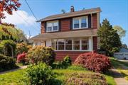 This delightful Rockville Centre Village colonial-style house on a 50x125 property has been expanded on the main level and second floor to offer additional living space. On the first floor, you will find an enclosed porch, a living room with hardwood floors, and a cozy fireplace. The house also boasts a formal dining room with built-in cabinetry, an eat-in kitchen equipped with gas cooking, and a lovely garden window. Furthermore, there is a spacious family room, a mudroom, and a brand-new full bathroom. Going up to the second floor, you will discover the extended primary bedroom with a dressing area and two additional closets, two generously sized bedrooms, and a full bath. An attic with walk-up access provides extra space. The basement is full with high ceilings. Make sure to check out this home. You will be pleased that you did.