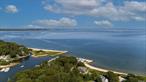 Welcome to your Bay Front paradise on the North Fork! This home has every aspect of beach living. Incredible views of Bug Light and Shelter Island. Two lots comprising 1.38 acres and over 286 feet of expansive sugar sand beach. Featuring an open gracious floor plan. 5 bedrooms, 4 baths, wraparound porch, outdoor shower, waterside gunite pool, outdoor kitchen area, a garage that houses a gym, living loft area and a full house generator! The additional lot has a building envelope for a 2700+ square foot home. The beauty of all of this and located in Flood Zone X! Surrounded by North Fork renowned farm stands, restaurants, beaches, marinas, boating, award winning wineries and great shopping.