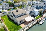 ***Welcome to this Absolutely Beautiful Waterfront Colonial Style Home with 60&rsquo; of Bulkhead Located on a Nice Quiet Street in Seaford Harbor!*** Get Ready to Enjoy the Waterfront Lifestyle You&rsquo;ve Been Waiting For! This Home Offers So Many Great Features & Amenities, Including a Brand New Custom Eat In Kitchen with Quartz Counter Tops, Stainless Appliances, Family Room Right Next to the Kitchen with Ductless Central Air, All Overlooking the Gorgeous Water views from Every Window! Plus a Fully PVC Fenced in Yard, Stone Patio with New Automatic Awning, Wood Burning Fireplace in the Living Room, Custom Flooring Throughout, Gas Heating System with Hot Water Heater, In Ground Sprinklers, Attached Two Car Garage with Paver stone Driveway, Large Master Bedroom with Walk In Closet & So Much More! Wood Bulkhead is in Excellent Condition. Property is Just a Short Distance From the Bay, Perfect for Fishing, Boating, Paddle Boarding & Kayaking. This Home is Priced to Sell, Ready to Move In & Won&rsquo;t Last! Low Flood Insurance $2120 a Year. Come See it Today!