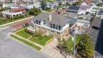 Step into the heart of Long Beach, where this exquisite Colonial awaits, mere steps from the ocean and boardwalk. Inside, discover six generously appointed bedrooms, including two en-suites spread across both the first and second floors. A second-floor extension, completed in 2019, infuses modern elegance to the already impressive size and layout of the home. Two cozy fireplaces, two waterview terraces, expansive living areas, garage parking, and a fully finished walk-out basement with a bathroom - THIS home has enough space to luxuriate in comfort! Welcome to your coastal beach community, where sandy shores meet culinary delights and endless amenities. Discover a vibrant tapestry of seaside charm, with a plethora of top-notch restaurants, boutique shops, cozy cafes, rejuvenating spas, and recreational activities galore. Experience the perfect blend of coastal relaxation and urban sophistication in this beachside haven!