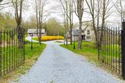 Discover the epitome of country living at this custom built home nestled off a quiet country road in the beautiful Hudson Valley. The main level includes a great room, separate formal dining room, kitchen, fireplace and office. The upper level, accessed by two beautiful staircases, features the master suite with 2 additional bedrooms and the potential to make a 4th. Enjoy the serenity of the views from the large back deck.      A finished lower level with a full bath and access to the yard, a generator, an attached 2-car garage and a beautiful detached 3-bay garage finished with a cupola and versatile studio space above. This home has ample space for your vehicles and hobbies. Located in Verbank, a hamlet in the town of Union Vale, this spectacular setting is minutes from Millbrook, and is close to 2 Metro North train stations and all the attractions that make this region such a special place to call home. This 9 acre property is a rare find in a prime location!