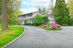 Quintessential 4 bedroom/3 full bath center hall Colonial with entry foyer, pretty white eat-in kitchen with stainless appliances and quartz counters, formal living room, formal dining room, family room with fireplace, main level laundry, all updated bathrooms, primary bedroom/primary bath, hardwood floors throughout, tastefully updated, full finished basement, gorgeous property situated on 1.3 acres with patio, heated in-ground salt-water pool with custom tile surround, estate fencing, new pool liner & heater, new cesspool, mature landscaping, circular driveway, prime location for quiet enjoyment. Half Hollow Hills schools with Signal Hill elementary.