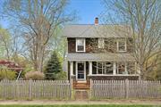 Quintessential 1920&rsquo;s farmhouse with many architectural details intact - pinewood floors, original hardware, glass-fronted built-in pantry, large front porch. Three light filled bedrooms, full bath and a half. Large property with ample room for pool & existing barn/garage with studio. Close to Village Center, 67 Steps Sound Beach, multiple local Vineyards & Farm stands. The property shines with authentic character.