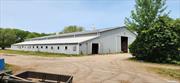 Opportunity Knocks w/ this 9.5 Acre Horse Farm located off the LIE which has been here for over 40 Years. 3 BR Ranch, 27 Stall Barn w/ 2 Tack Rms, Office, Bath & Indoor Shower Stall. There is a 16 Stall Barn w/ a Tack Rm & attached Indoor Arena 90x170, w/ viewing Rm & Judges Rm. The Side Barn has 12 Stalls, an 8 Stall Barn. Total of 63 Stalls plus 5 In & Outs. 35 Turn Outs for Horses, 3 Outside Arenas & just minutes to open trails that are great for an hour in the woods. Property has Frost Free Hydrants throughout, Storage Sheds, a Container & a Tractor Trailer Box used to store Hay & Shavings. Agriculture Zoned Property w/ options to grow your own crops, SOD Farm & Plants. Sub- Dividable Land for Contractors to build. Business is currently operating Full board & Rough board. Make your own Dream come true to own almost 10 Acres here on Long Island w/ easy access to the LIE here in Medford & a short ride to the Hamptons! Taxes w/ Agricultural exemption is $35, 698.75