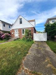 Brick/Frame Cape In Bellerose 1st Floor Featuring Living Room, Kitchen, Dinning Room, 1 Bedroom, Full bath and Four-season / Sun Room. 2 Bedrooms On The 2nd Floor With Large Walk-in Closet. Andersen Windows and 1 Large Car Garage and remote garage door. Full Finished Basement with separate entrance. Located In School District 26 And Close To Public Transportation, Major Highways, and Stores.