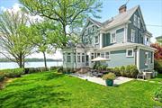 QUEEN ANNE VICTORIAN situated in the Historic District of Douglas Manor, by the famous Carl P. Johnson architect. This distinguished home has captivated admirers for generations and occupies a special corner on the waterfront. Your first introduction is a wrap-around porch with ionic columns, balustrades, and stone steps, and double cut-glass entry door. The first floor has a parlor with French doors followed by a music area. The sun room/conservatory has radiant heat with total water view. Chef&rsquo;s kitchen with all the bells and whistles; sub - zero refrigerator, sharp microwave AGA stove and marble countertops and powder room tucked away. The classic touches in the formal dining room are many. The walls are adorned with wainscoting, the original handmade Mercer tiles, and the original wood burning fireplace. The exceptional wood floors throughout add to the history of this home. The second floor has sweeping water views from every corner. There are 2 bedrooms plus a primary suite/spa Bathroom, built-in window seat, walk-in closet and fpl. The third floor has three bedrooms, Art room and full bath. There is a matching garage with loft area. Many original and preserved notable features. The original craftsmanship is preserved and exceptional.! Three zone Central Air, 10 ceilings, stain-glass windows, radiant heat in the kitchen, powder room and all other baths. Douglas Manor was founded in 1906, a community of spectacular single homes . Picture yourself here.