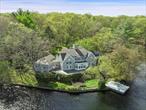 Located between historic Bedford Village and Pound Ridge, New York is 6.1 acres waterfront property on the private 46 acre Blue Heron Lake. This stunning and exclusive property is surrounded on three sides by water and overlooks the 36 acre Morgantheau Preserve. The sun filled 1982 contemporized colonial has 3 family bedrooms and 3.1 bathrooms. Highlights include a first floor Primary suite with bathroom, large walk-in-closet, dressing area and nursery. Walls of windows overlook panoramic views of Blue Heron Lake. Added amenities include a 2 bedroom cottage and a clay tennis court. A private dock provides endless opportunities to swim, canoe, kayak and fish from the privacy of your property! Blue Heron Lake is home to over 120 species of birds, a bird watcher&rsquo;s paradise. Mature specimen trees gives life to a picturesque landscape. 28 Heron Lake Dr offers the ultimate lakefront lifestyle, within 60 minutes of NYC. Minutes to shopping and train. Additional Information: Amenities:Storage, Tennis, ParkingFeatures:2 Car Attached,